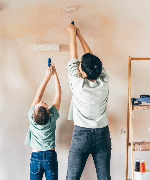 Happy,Mother,,Douther,And,Son,Painting,Wall,With,Roller.,Mom